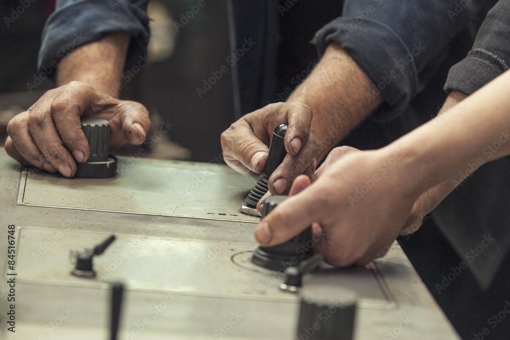 The hands of the two working switch levers and knobs The hands of the two working switch levers and knobs