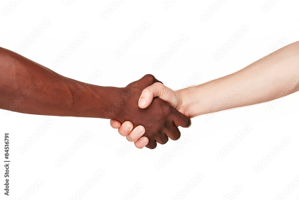 Black and white human hands in a modern handshake 