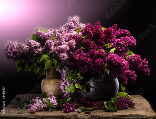 Still life with blooming branches of lilac