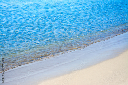 blue and golden shore in Alghero