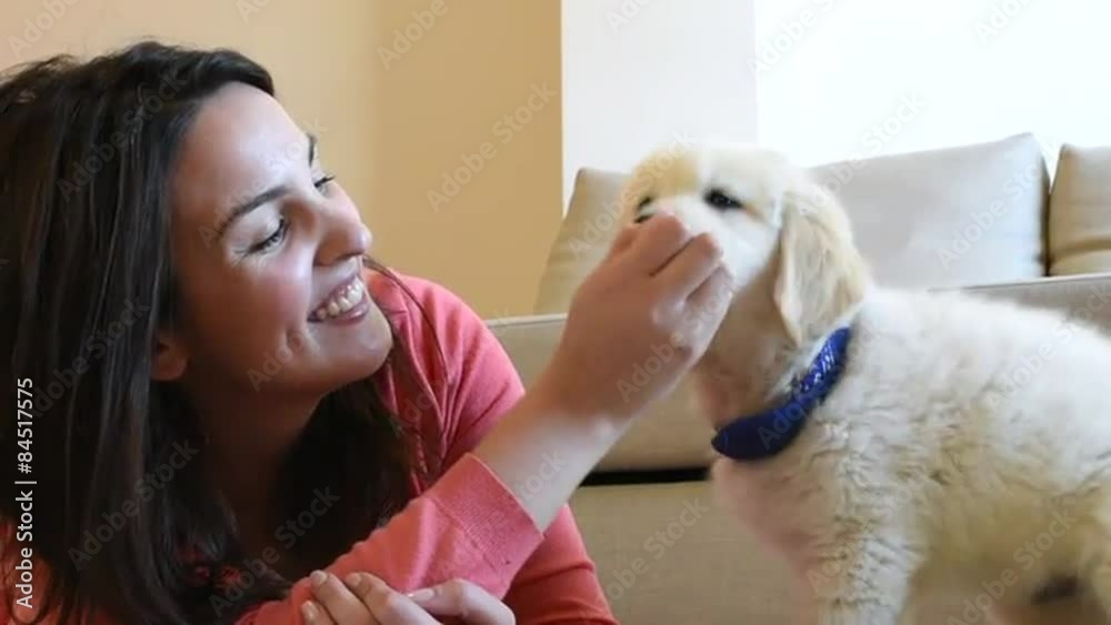 Woman with puppy at home