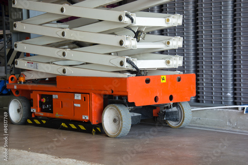 warehouse hall with hydraulic scissors lift