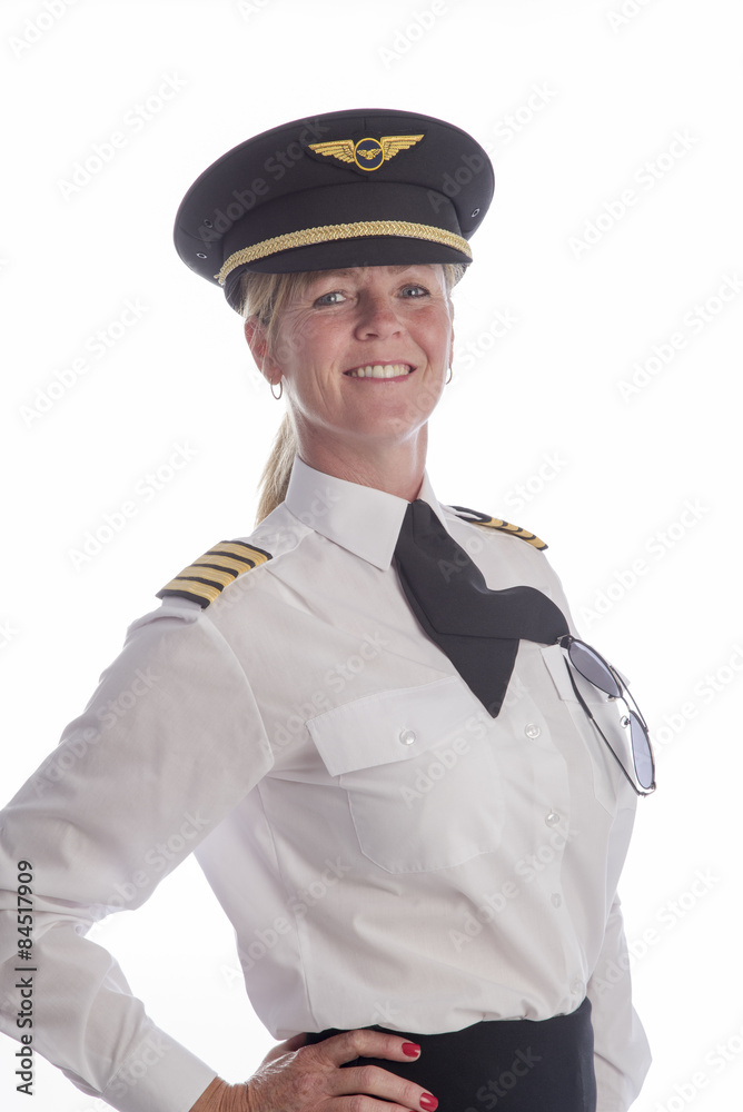 Portrait of an attractive mid age female senior airline pilot