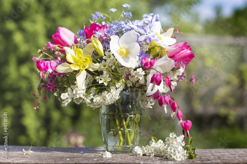 A bouquet of beautiful flowers against a green garden 2