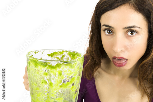 Green smoothie woman unhappy, close up
