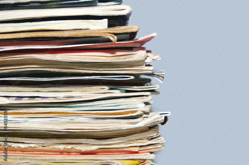 Pile of old magazines and books close up Pile of old magazines and books close up