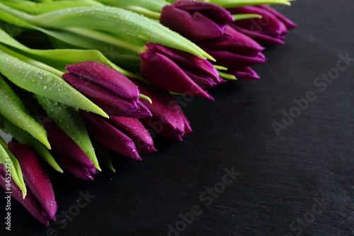 Fototapeta Naklejka Na Ścianę i Meble -  beautiful fresh tulips on slate