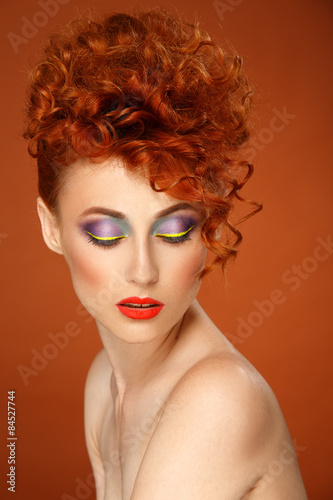 Red-haired. Beautiful girl with bright makeup