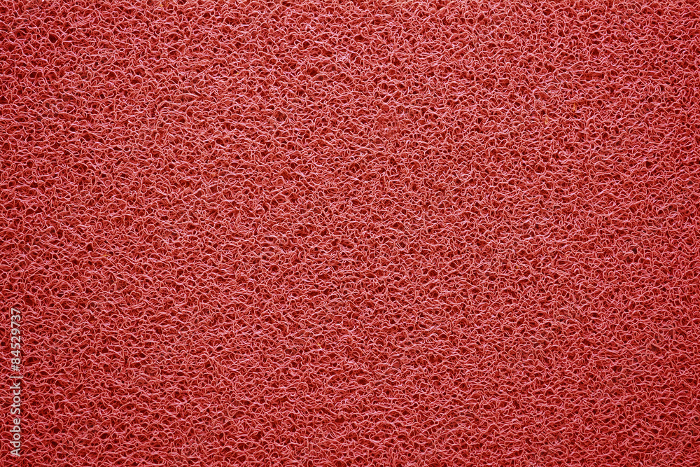 Naklejka premium Red doormat texture background.