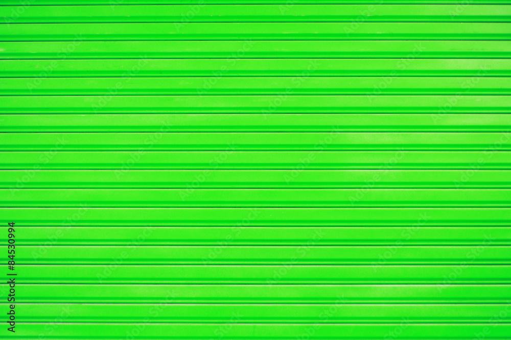 Close up green metal sheet slide door texture background. Close up green metal sheet slide door texture background.