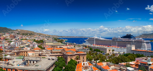 Luxury cruise ship is docked in the port of Messina.