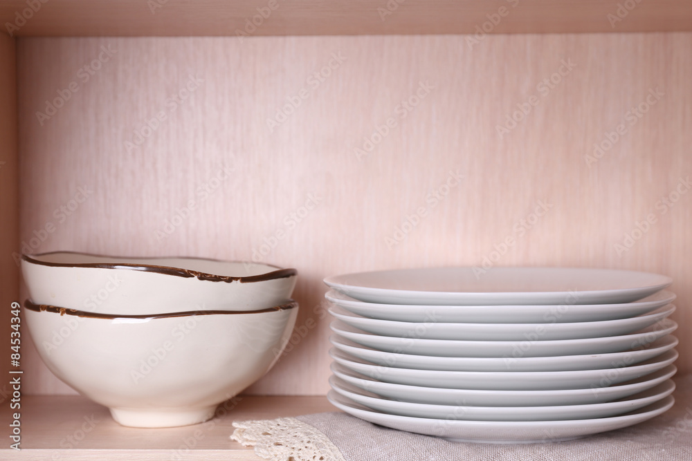 Tableware on wooden shelf Tableware on wooden shelf