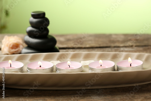 Beautiful spa composition on wooden table  on green background