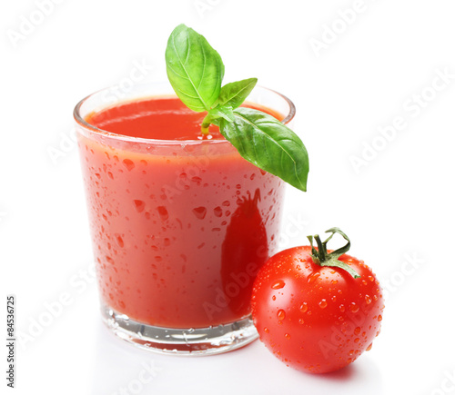 Glass of fresh tomato juice isolated on white