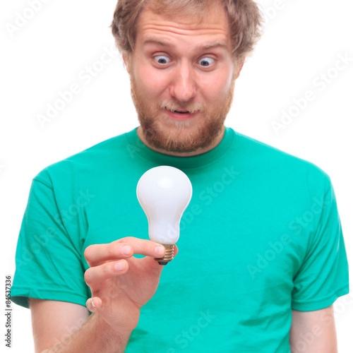 Surprised man holding a bulb