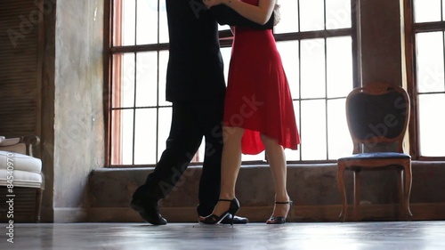 Tango dancers foot in vintage hall