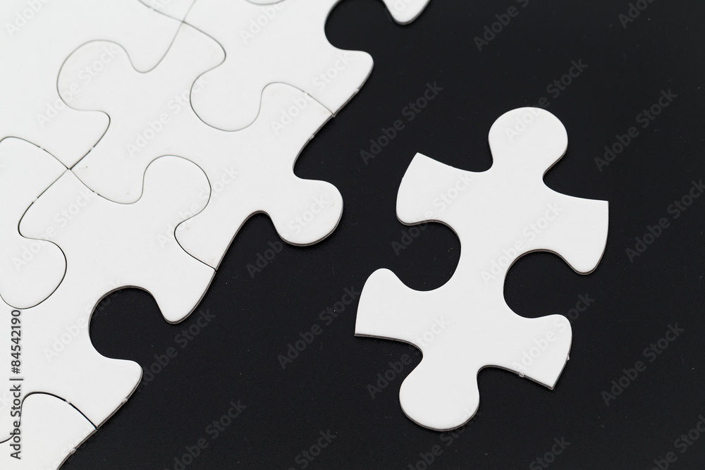 Jigsaw pieces isolated on black Jigsaw and puzzles concepts Jigsaw pieces isolated on black Jigsaw and puzzles concepts