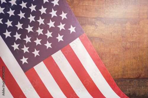 Fototapeta Naklejka Na Ścianę i Meble -  USA Stars and Stripes Flag on Dark Wood