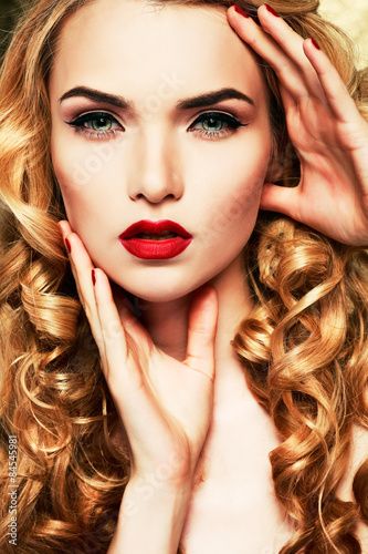  young woman with beautiful blue eyes and red lips 