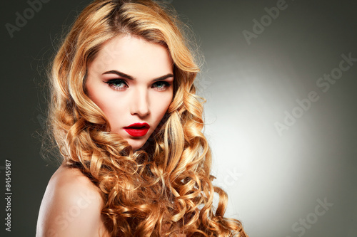  young woman with beautiful blue eyes and red lips 