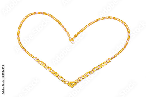 Gold necklace in love shape over white background