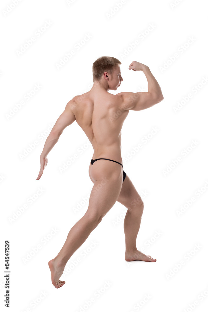 Bodybuilder posing at camera, isolated on white