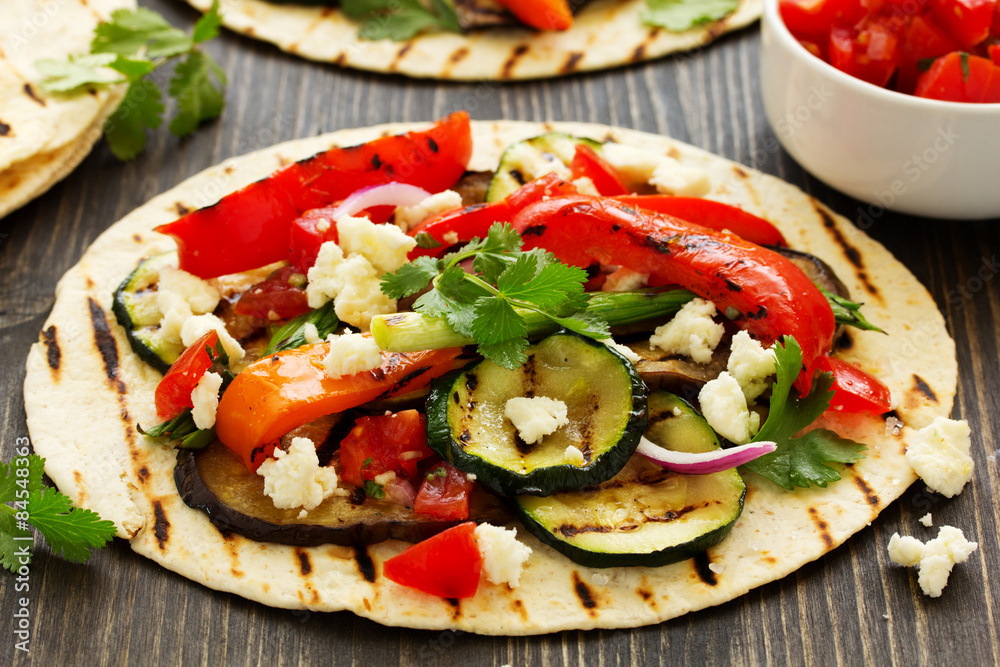 Vegetarian snack tacos with grilled vegetables and salsa. Vegetarian snack tacos with grilled vegetables and salsa.