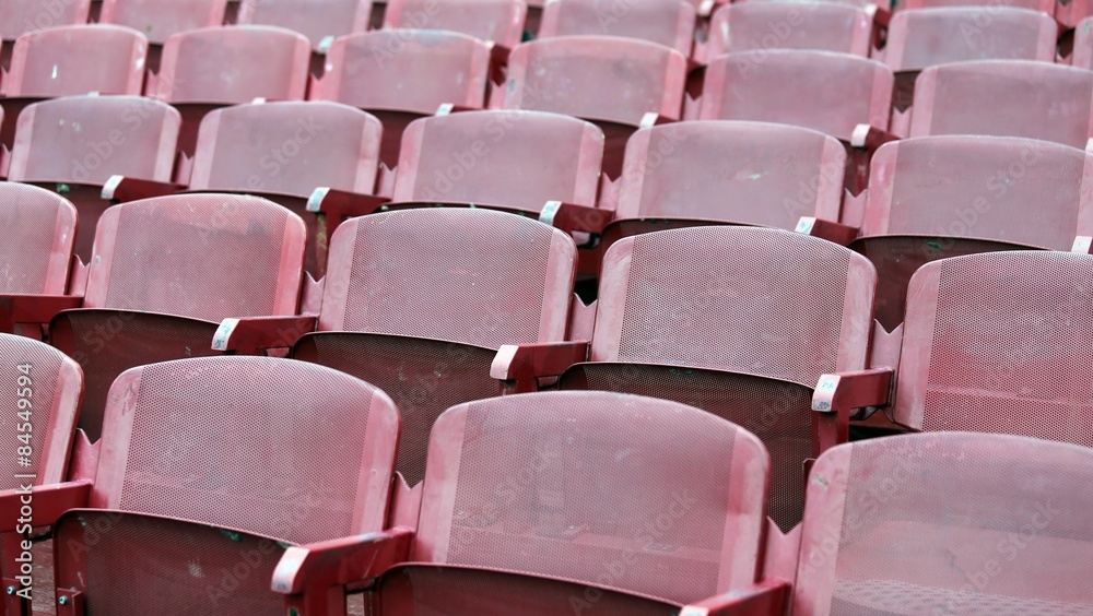 red empty chairs in the stadium red empty chairs in the stadium