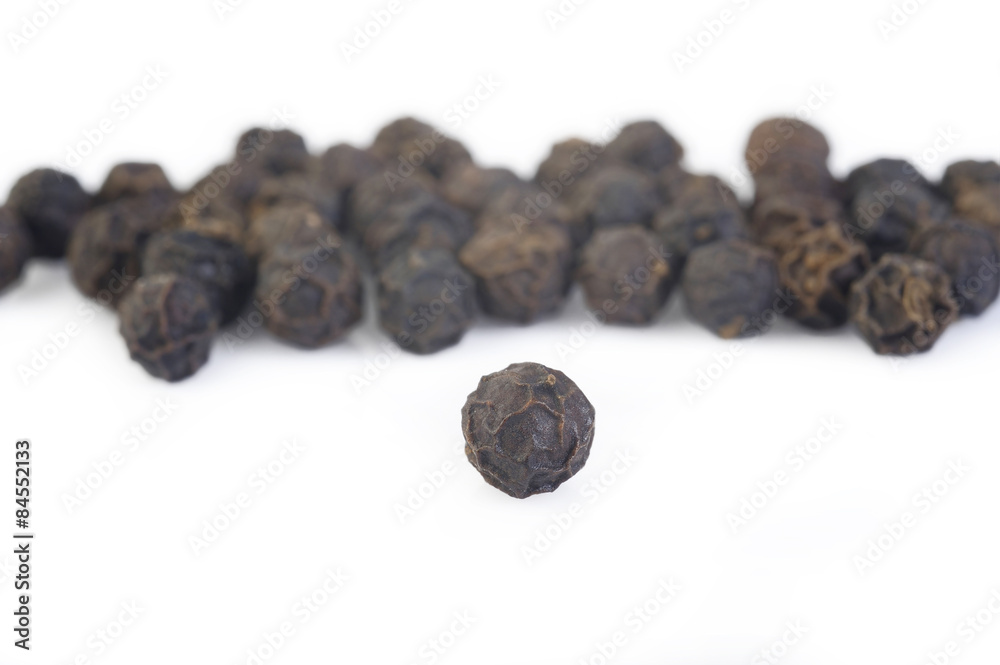 Black pepper seeds on white background Black pepper seeds on white background