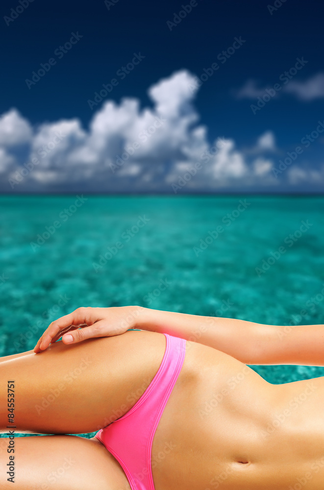 Woman on tropical beach at Maldives