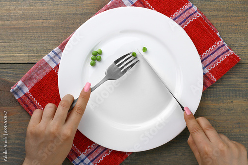 Pea in the plate, knife and fork. Diet.