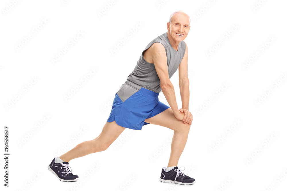 Active senior man doing stretching exercises Active senior man doing stretching exercises