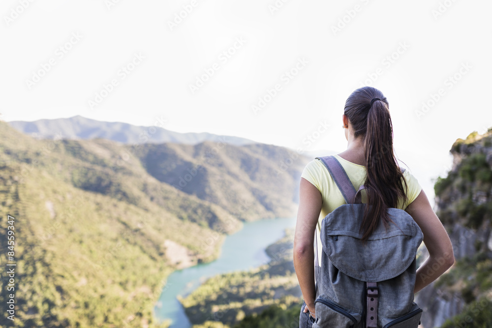 young woman on top of a mountain with good views