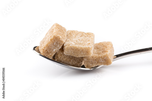 Cubes of sugar on a spoon