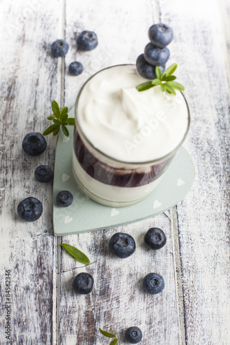 Glass of yogurt with fresh blueberries