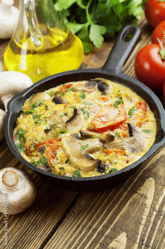 Omelet with mushrooms and tomatoes. Frittata