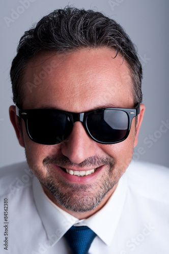 Fototapeta Naklejka Na Ścianę i Meble -  Cool business man wearing shades or sunglasses