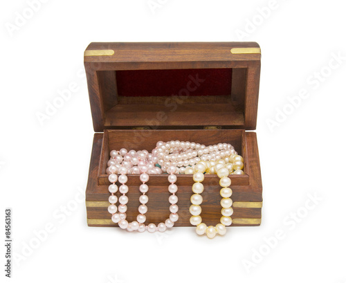 Small wooden chest with pearl necklace