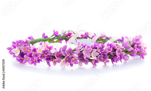 tiara of artificial flowers isolated on white background