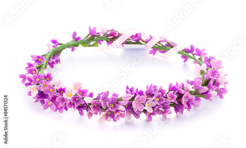 tiara of artificial flowers isolated on white background