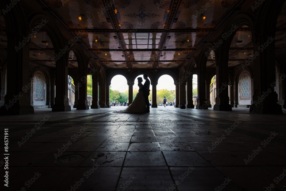 Unidentified married couple silouette under Bethesda Terrace in
