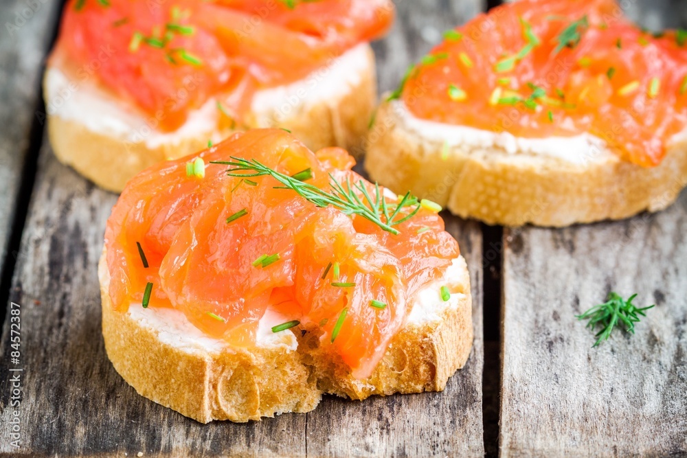 Appetizer canapes of baguette with smoked salmon Appetizer canapes of baguette with smoked salmon