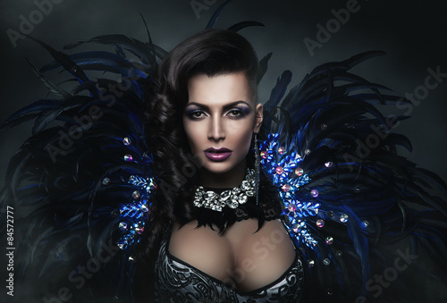 diva in accessory of diamonds and black feathers