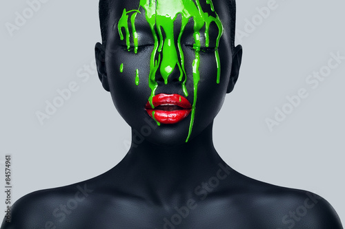 woman with flowing green paint