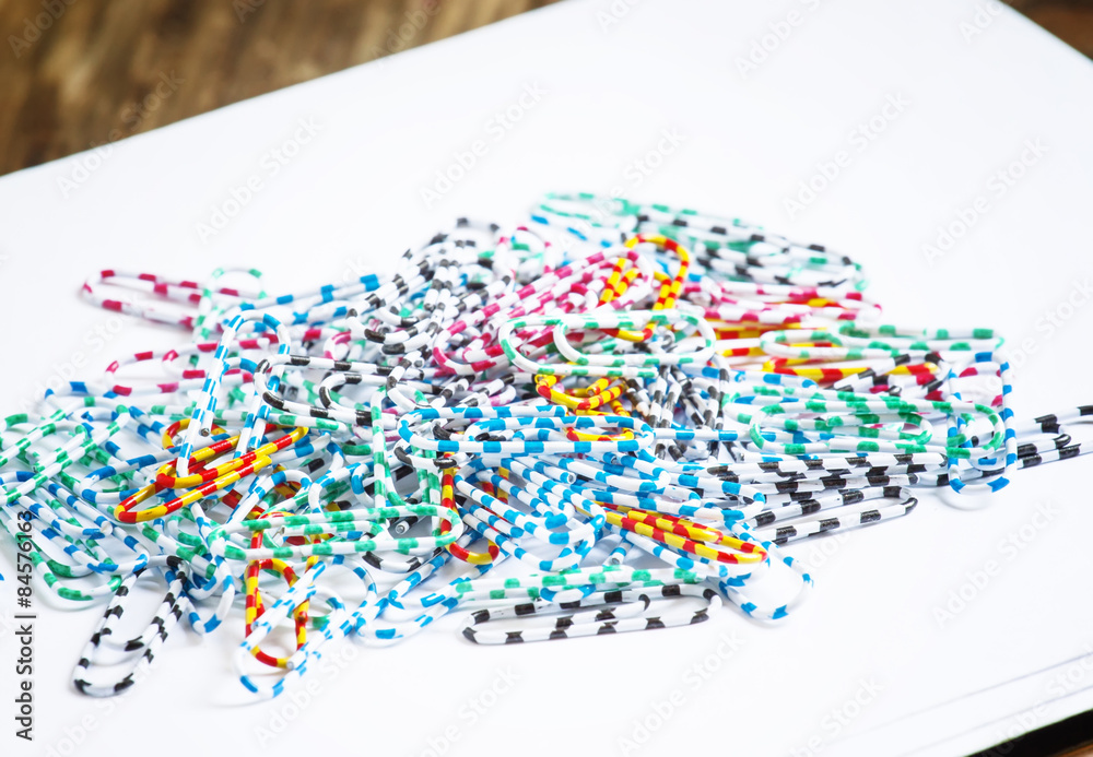 Fototapeta premium Office colored paper clips, selective focus