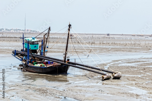 Fishing boat at ebb tide waiting for the flood tide  Chonburi  Thailand