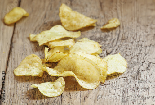 Golden potato chips, selective focus