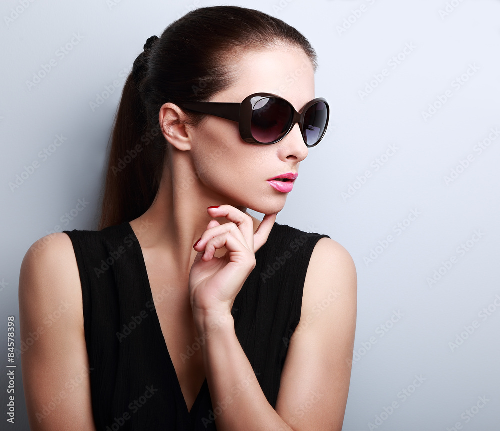 Fashionable beautiful young female model profile in sun glasses