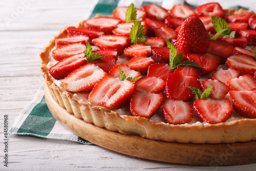 strawberry tart with cream cheese and mint closeup. Horizontal 