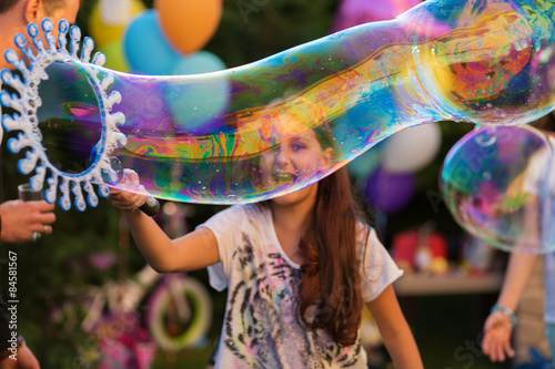 Happy girl with bubbles